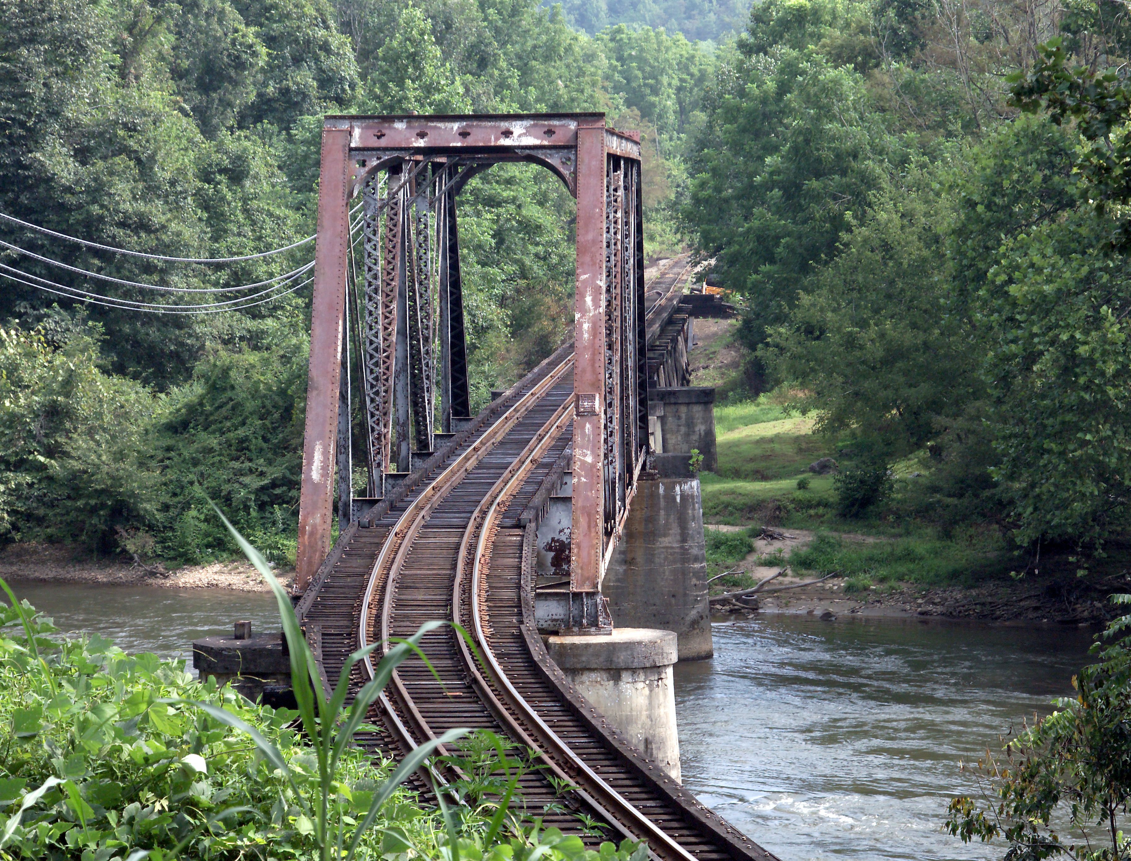 Vintage railroad bridge over river in West Virginia