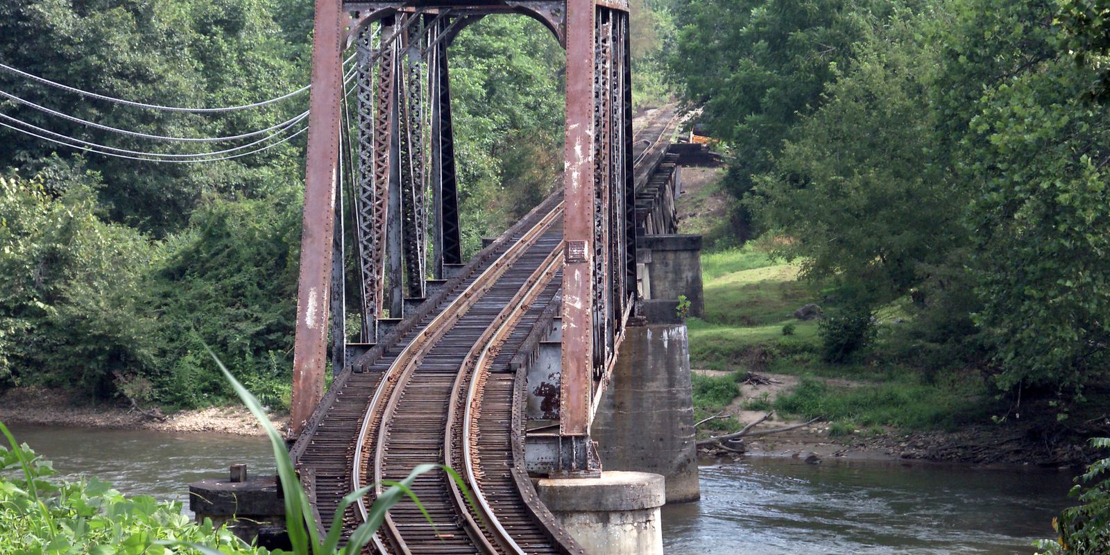 Vintage railroad bridge over river in West Virginia