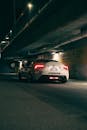 Sports Car Under Bridge at Night