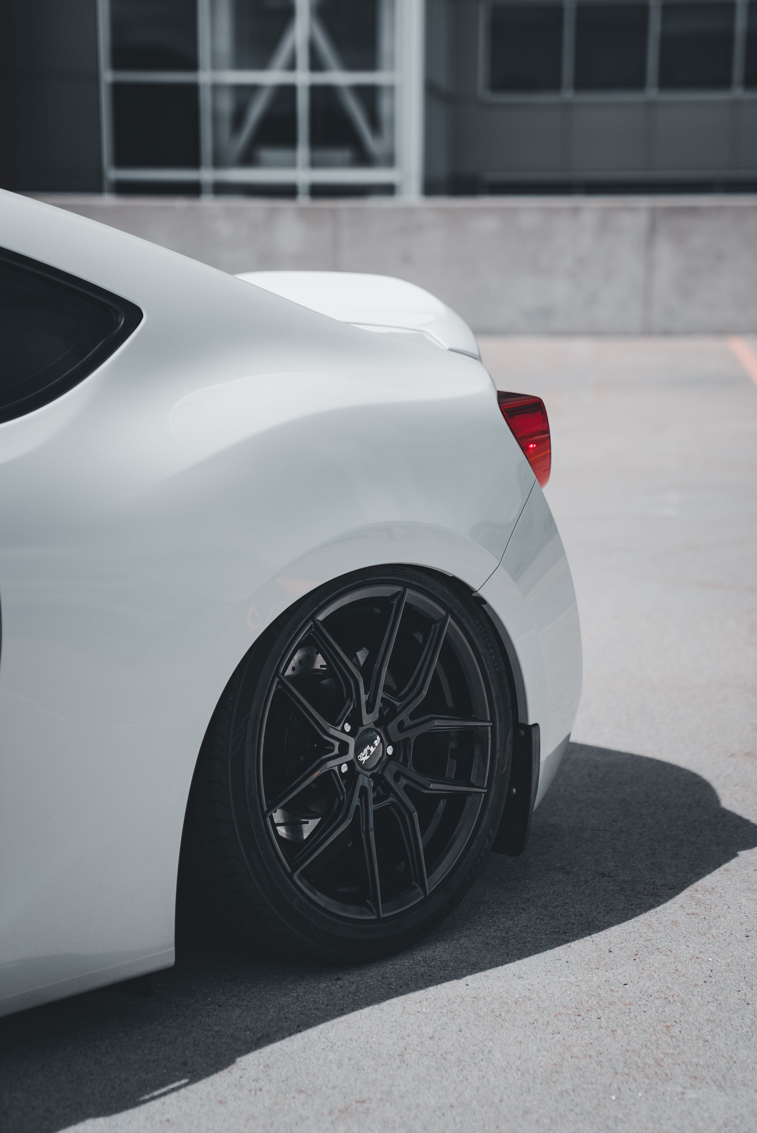 Sleek White Sports Car with Custom Black Rims · Free Stock Photo