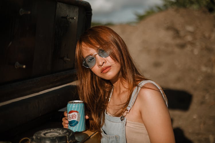 Woman Holding Soda Can