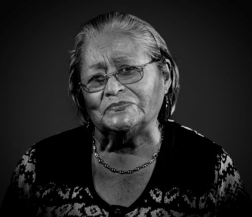 Free A moving black-and-white portrait of an older woman conveying wisdom and experience. Stock Photo