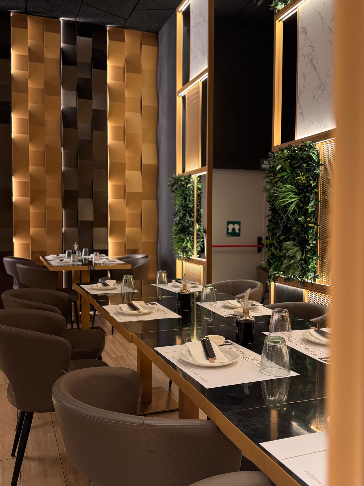 Modern restaurant interior with tables and greenery