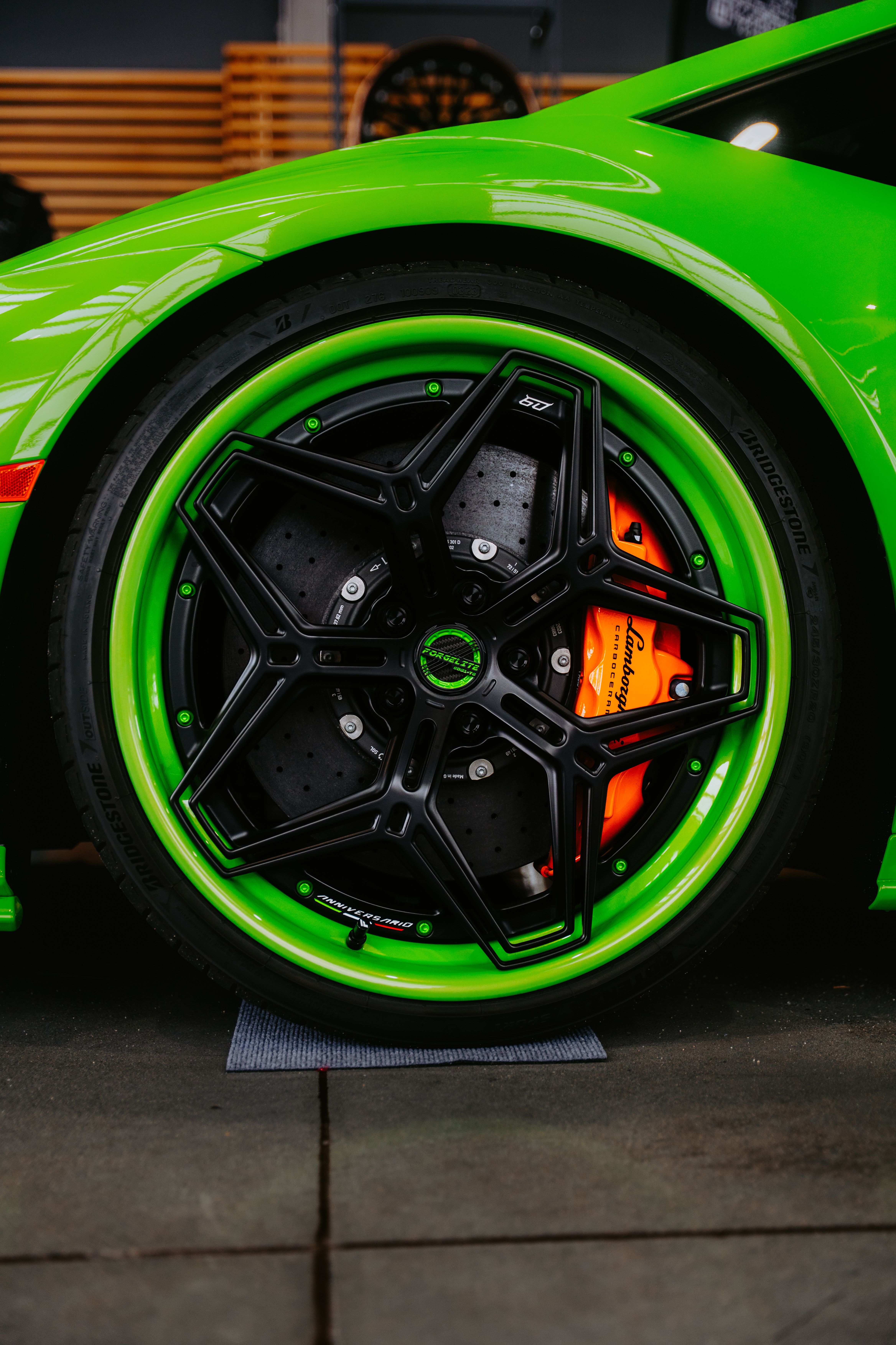 Close-up of Vibrant Green Sports Car Wheel · Free Stock Photo