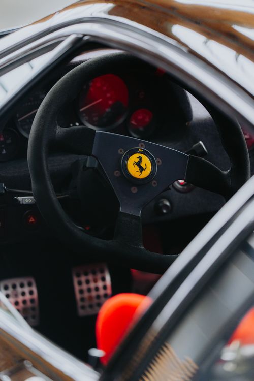 Free Detailed interior view of a luxury sports car's steering wheel and dashboard. Stock Photo