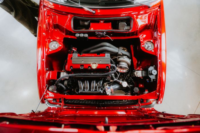 After engine bay cleaning — degreased and dressed engine bay