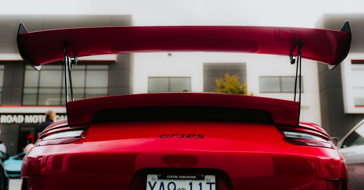 Red Sports Car with Prominent Rear Wing · Free Stock Photo