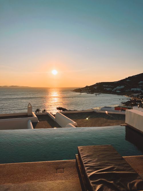 Free Breathtaking sunset view over the Mediterranean from an infinity pool in Mykonos. Stock Photo