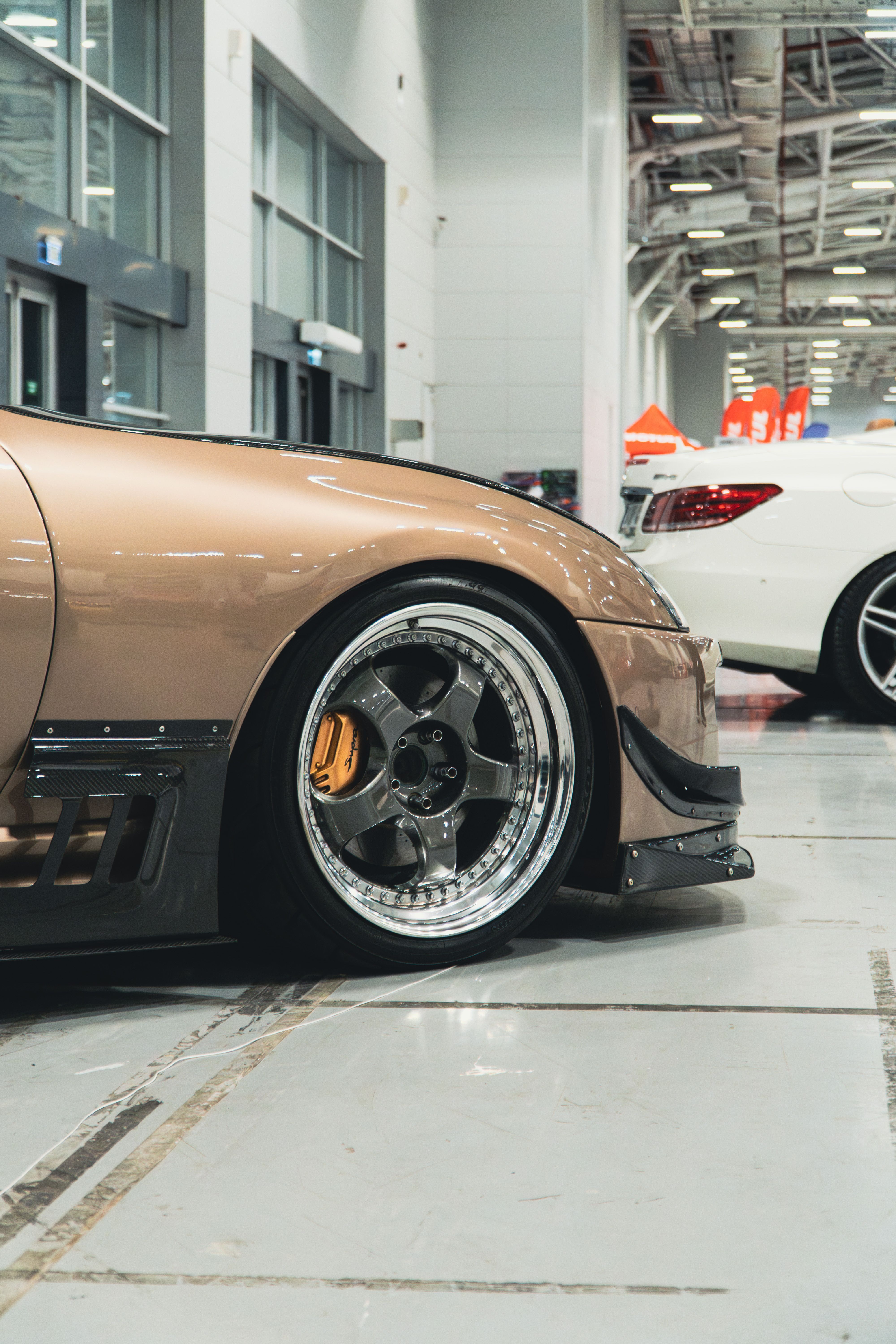 Sleek Modified Car in Indoor Auto Showroom · Free Stock Photo