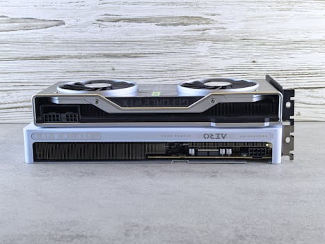 Two modern graphics cards stacked on a wooden surface, showcasing sleek design and advanced technology.