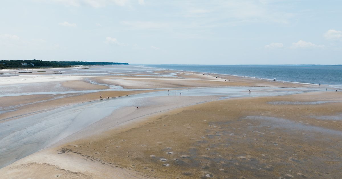Aerial view of the serene and expansive beach at Hilton Head Island, South Carolina.
