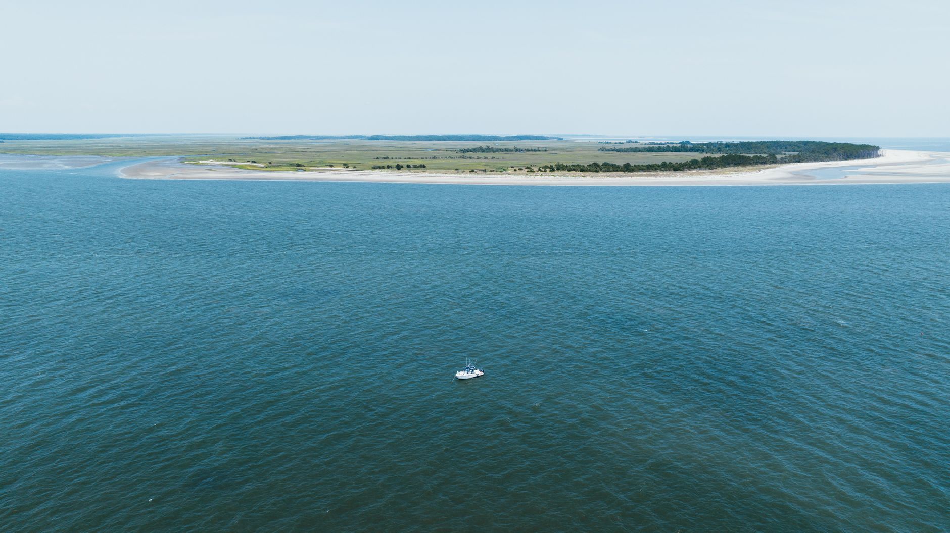 Aerial shot of a boat near the shoreline of Hilton Head Island, South Carolina.
