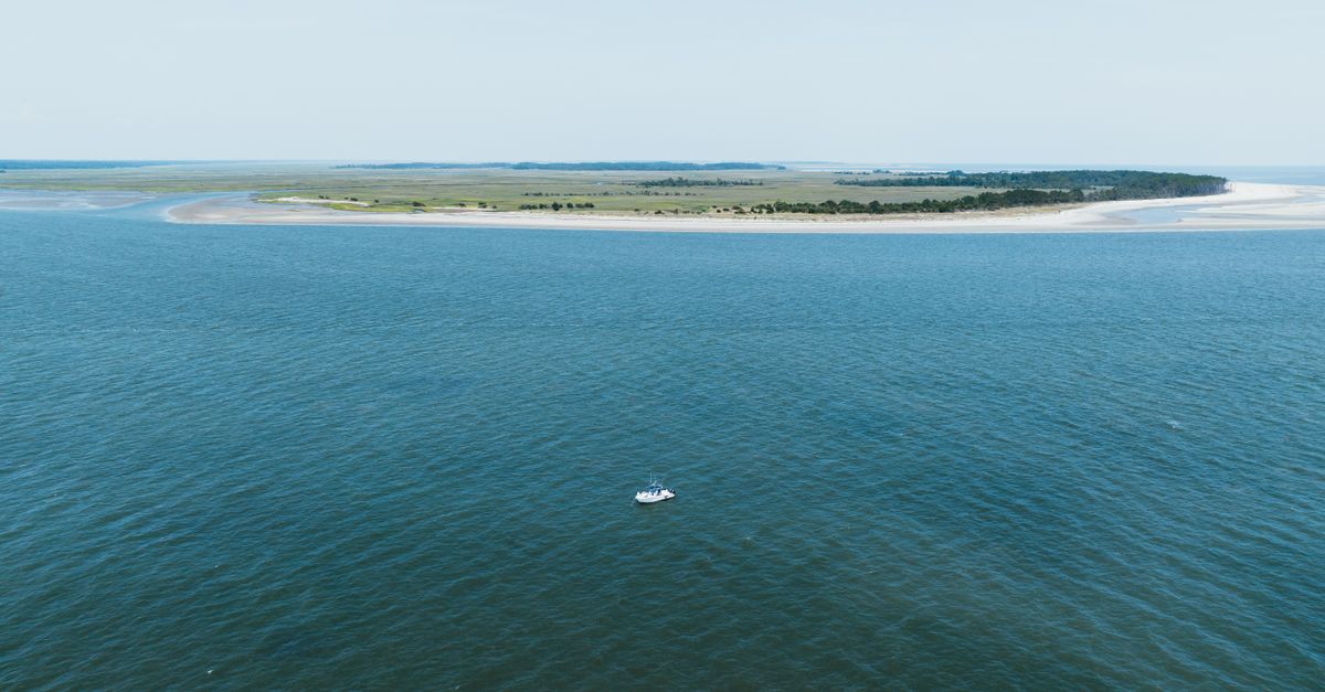 Aerial shot of a boat near the shoreline of Hilton Head Island, South Carolina.