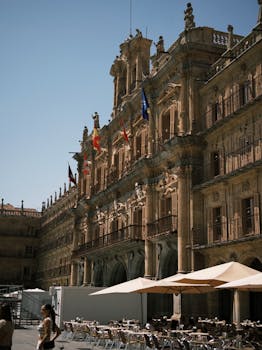 Elegant Plaza Mayor in Salamanca with classic architecture under sunny skies.