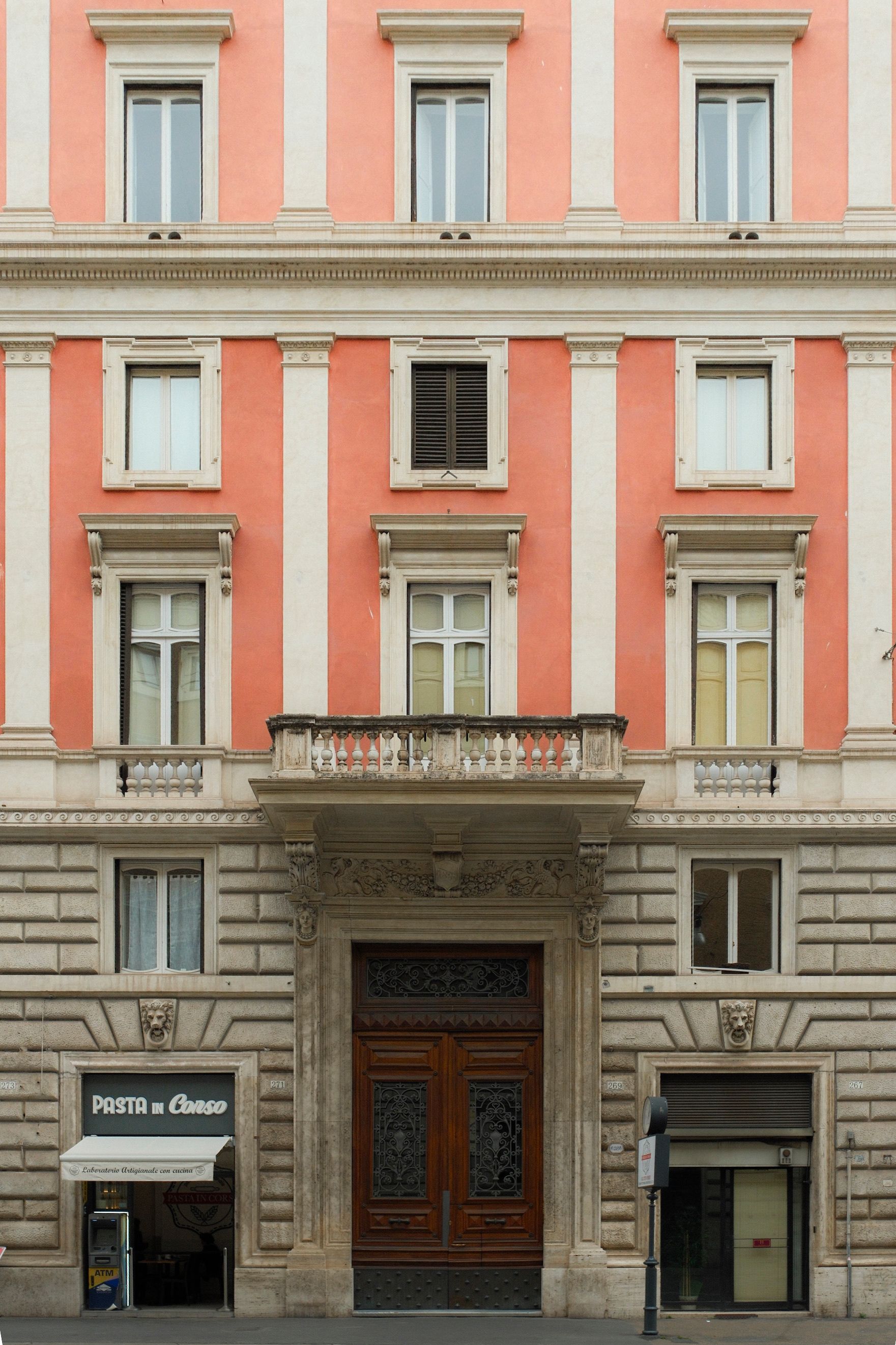Elegant Italian Building Facade with Shops · Free Stock Photo