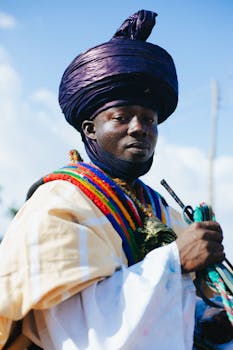Vibrant image of a man in ornate cultural clothing and colorful turban.