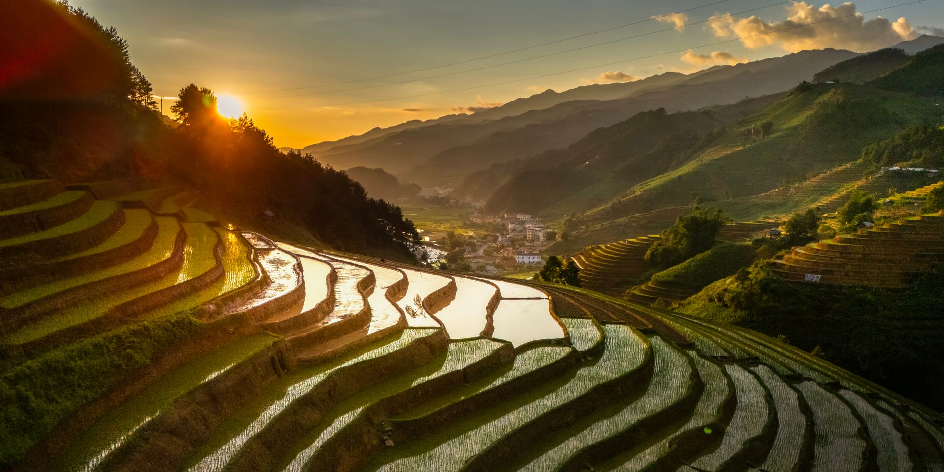 Captivating sunrise view of rice terraces in Vietnam, highlighting agricultural beauty and natural landscapes.