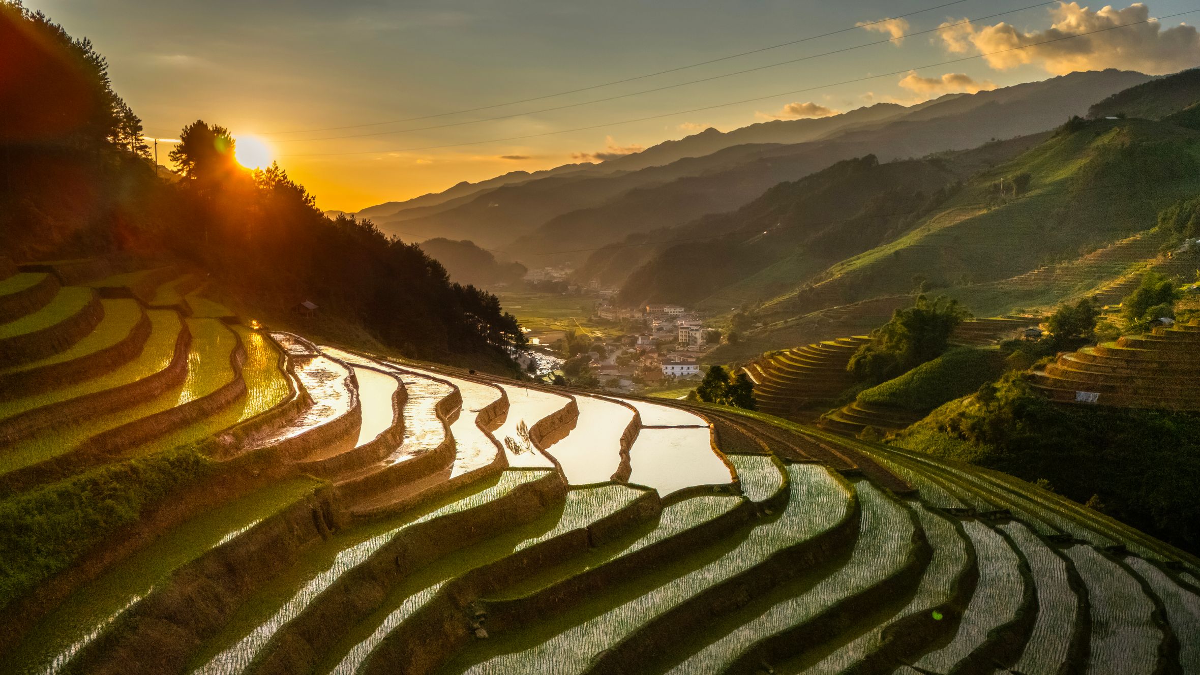 Captivating sunrise view of rice terraces in Vietnam, highlighting agricultural beauty and natural landscapes.