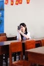 Young Woman Taking Selfie in Classroom Setting