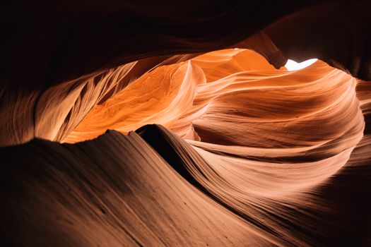 Captivating light and shadow play in Antelope Canyon's stunning sandstone formations.