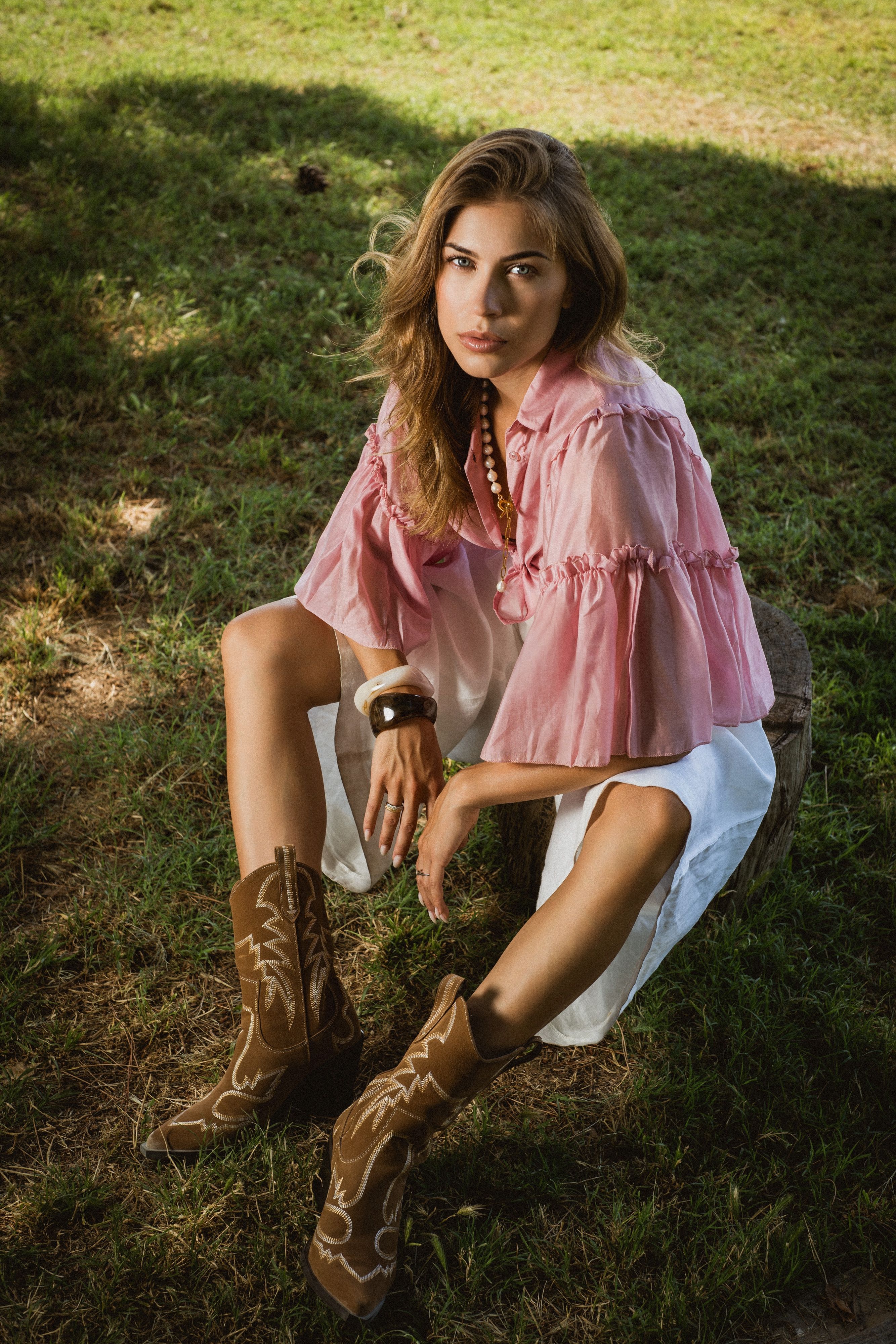 Stylish Woman in Cowboy Boots Outdoors · Free Stock Photo