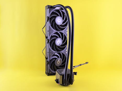 Close-up of a modern CPU cooler with triple fans against a vibrant yellow backdrop, ideal for tech blogs and reviews.