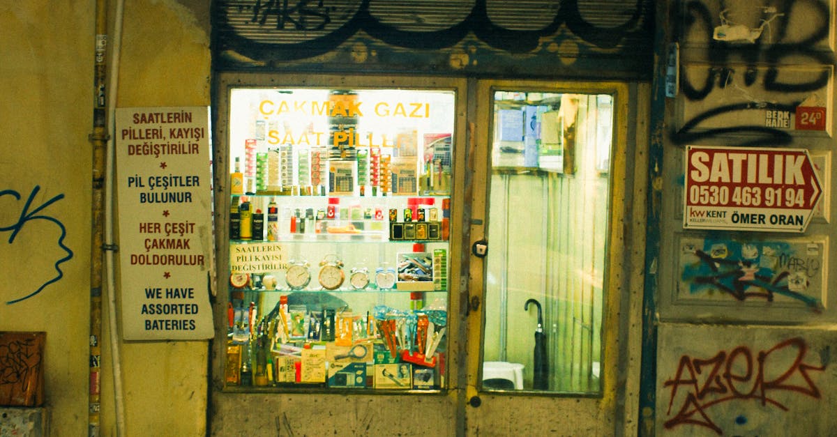 A small shop illuminated at night showcases an urban street ambiance.
