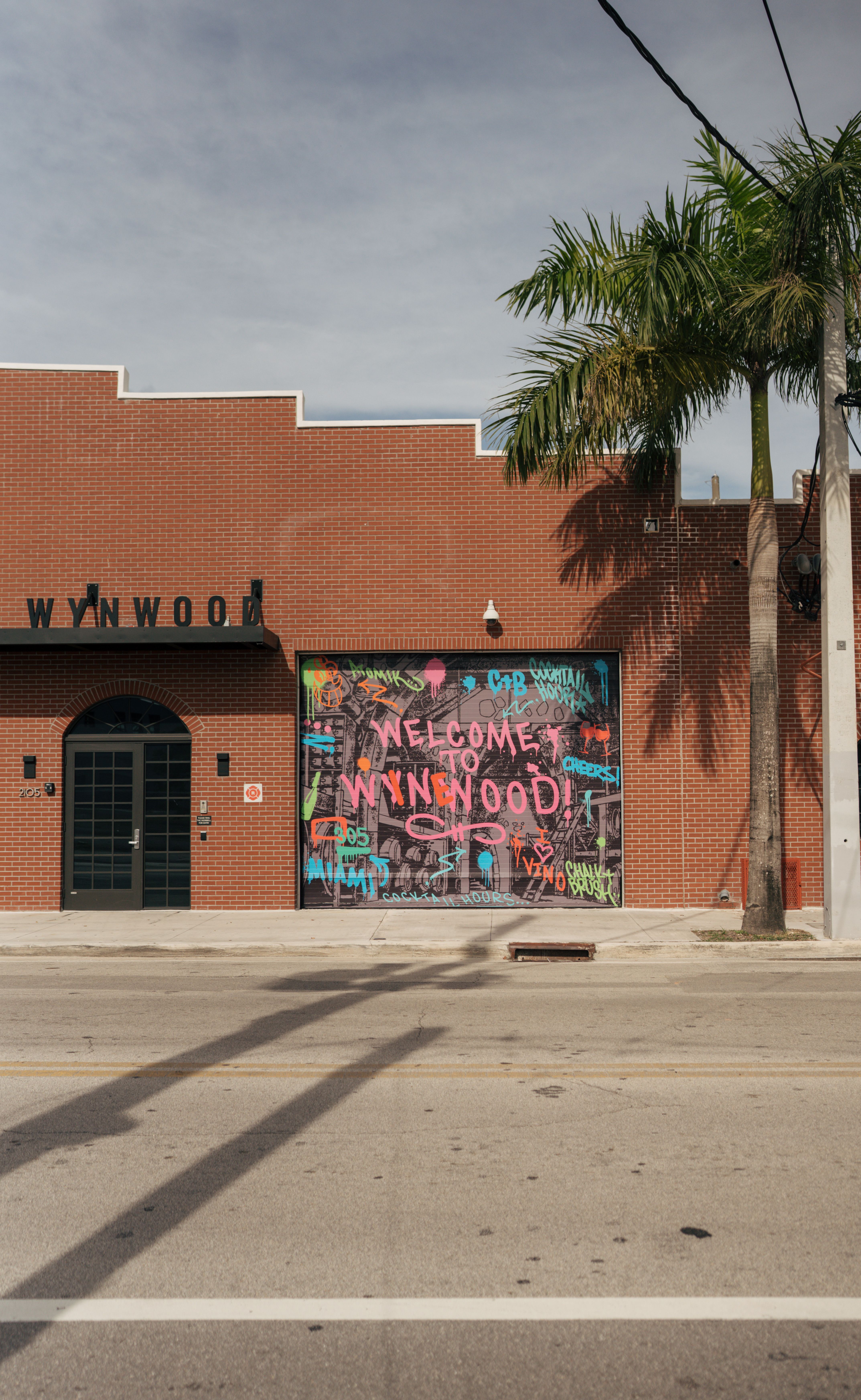 Colorful mural-covered wall in Miami’s Wynwood district.