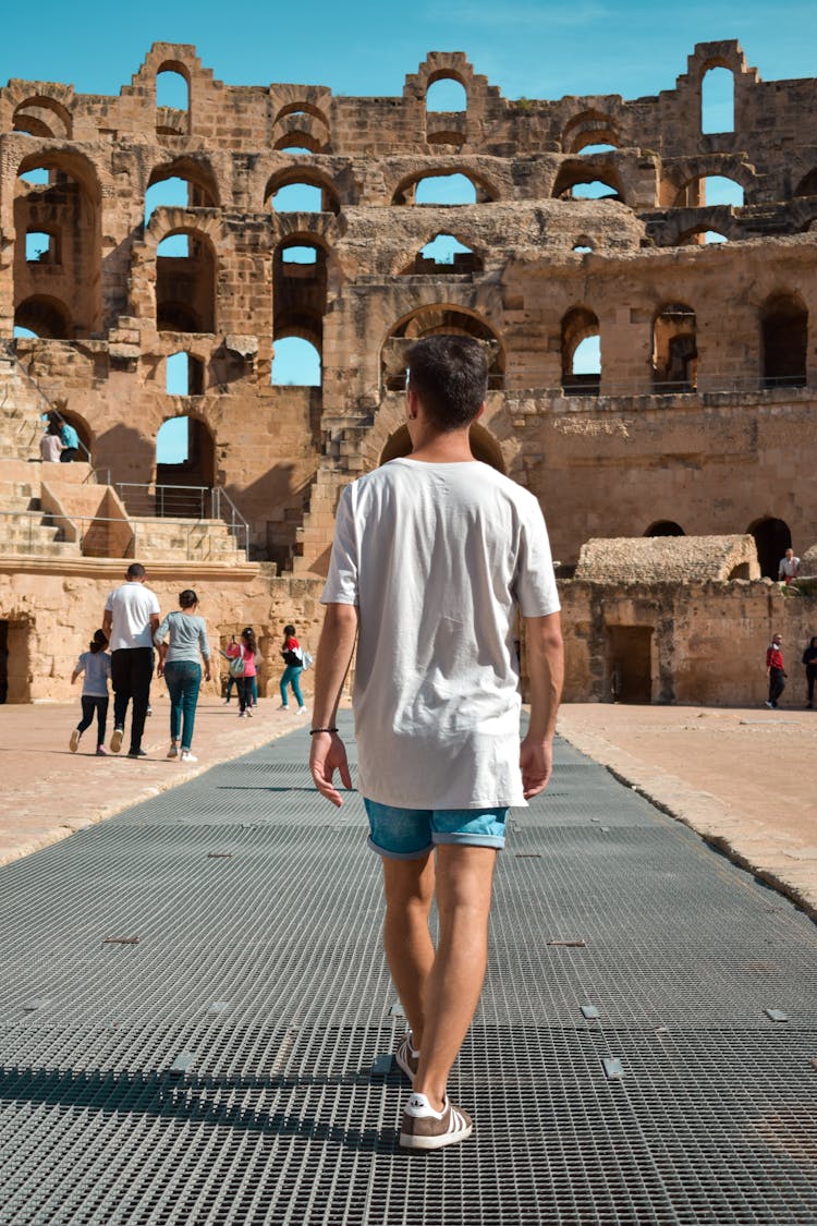 Photo Of Man Standing In El Jem Amphitheatre