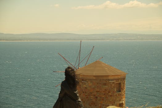 A serene view of a windmill overlooking the Aegean Sea at Çanakkale, Türkiye.