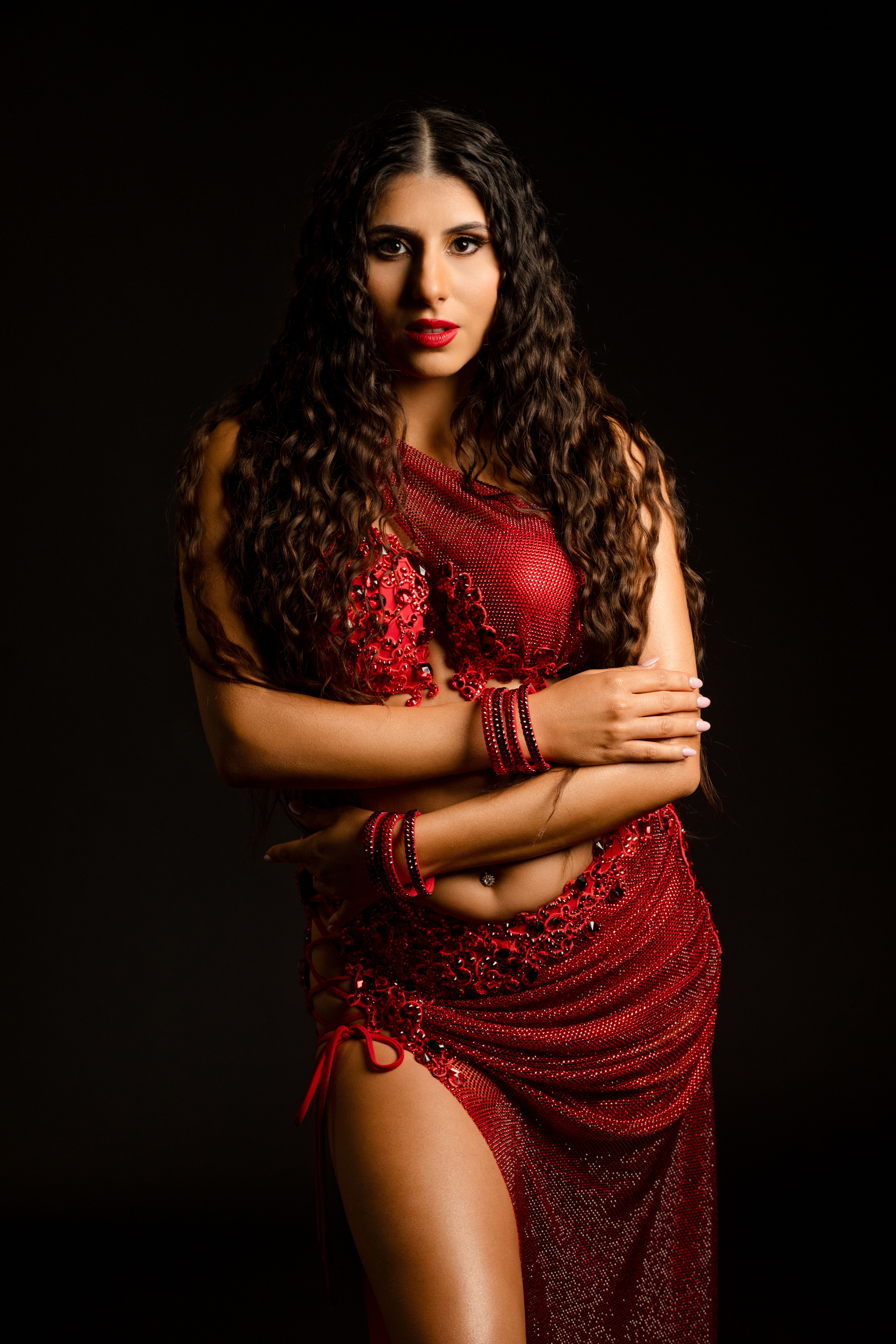Dynamic Portrait of Woman with Curly Hair in Red · Free Stock Photo