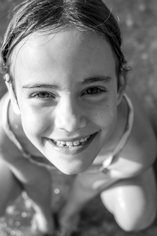 Grey-scale Photo of Girl smiling