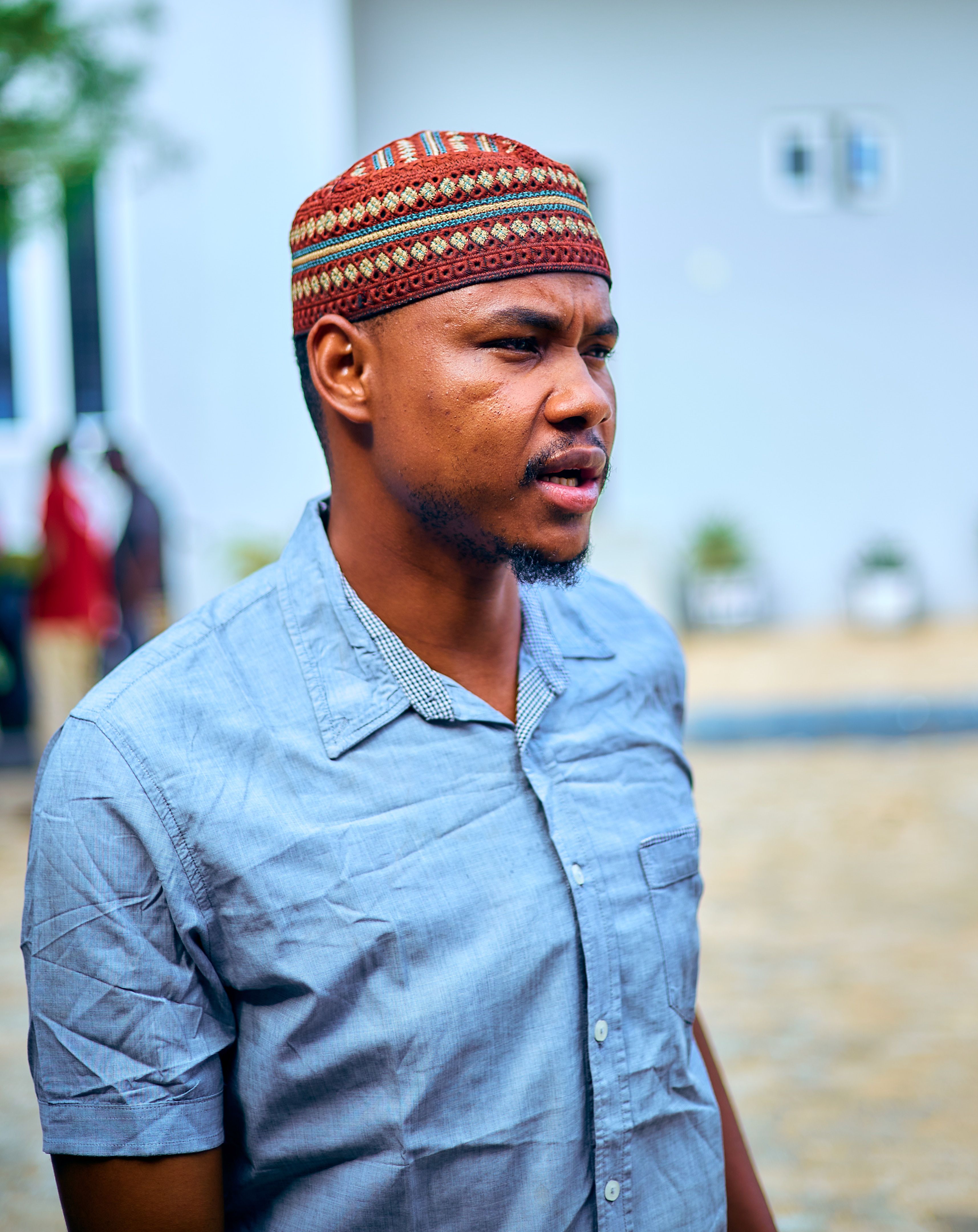 Portrait of a Man in a Traditional Cap Outdoors · Free Stock Photo