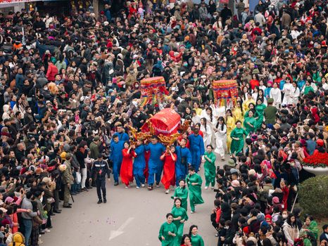 Colorful procession highlighting Ky Cung Ta Phu Temple Festival in Lạng Sơn, Vietnam, with crowds celebrating cultural heritage.