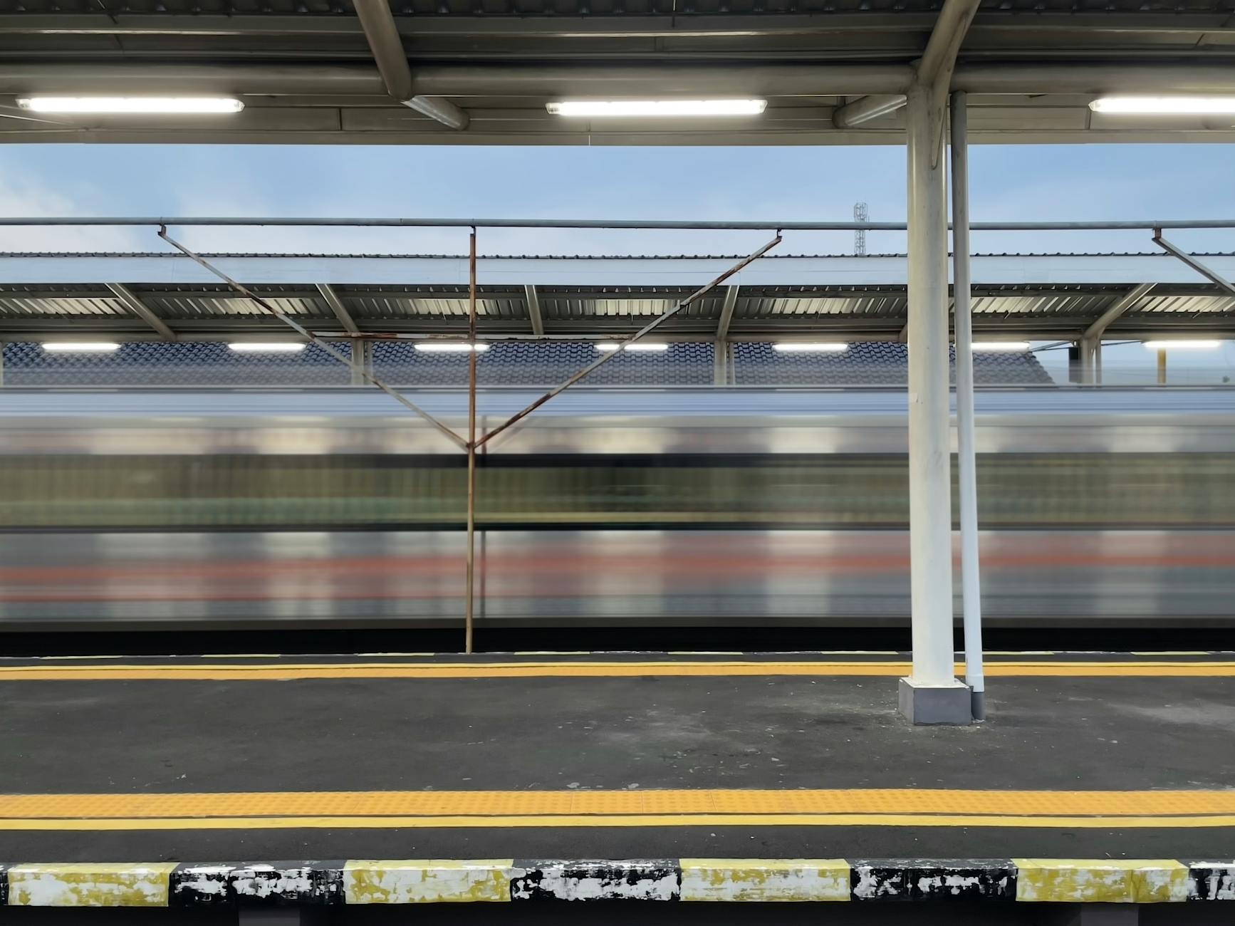Namo Bharat rapid rail train at a Ghaziabad station with the elevated corridor stretching east