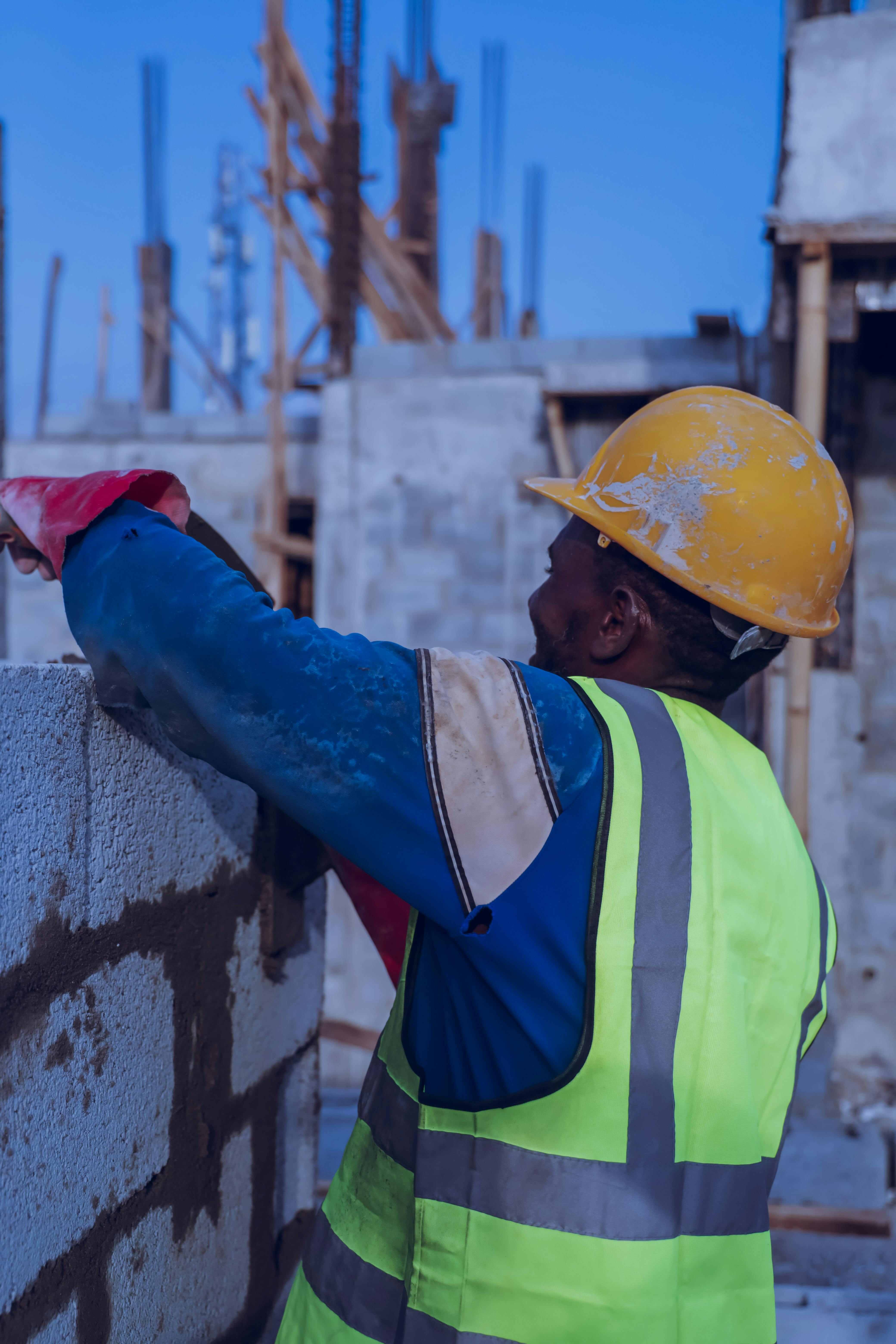 A bricklayer building a wall.
