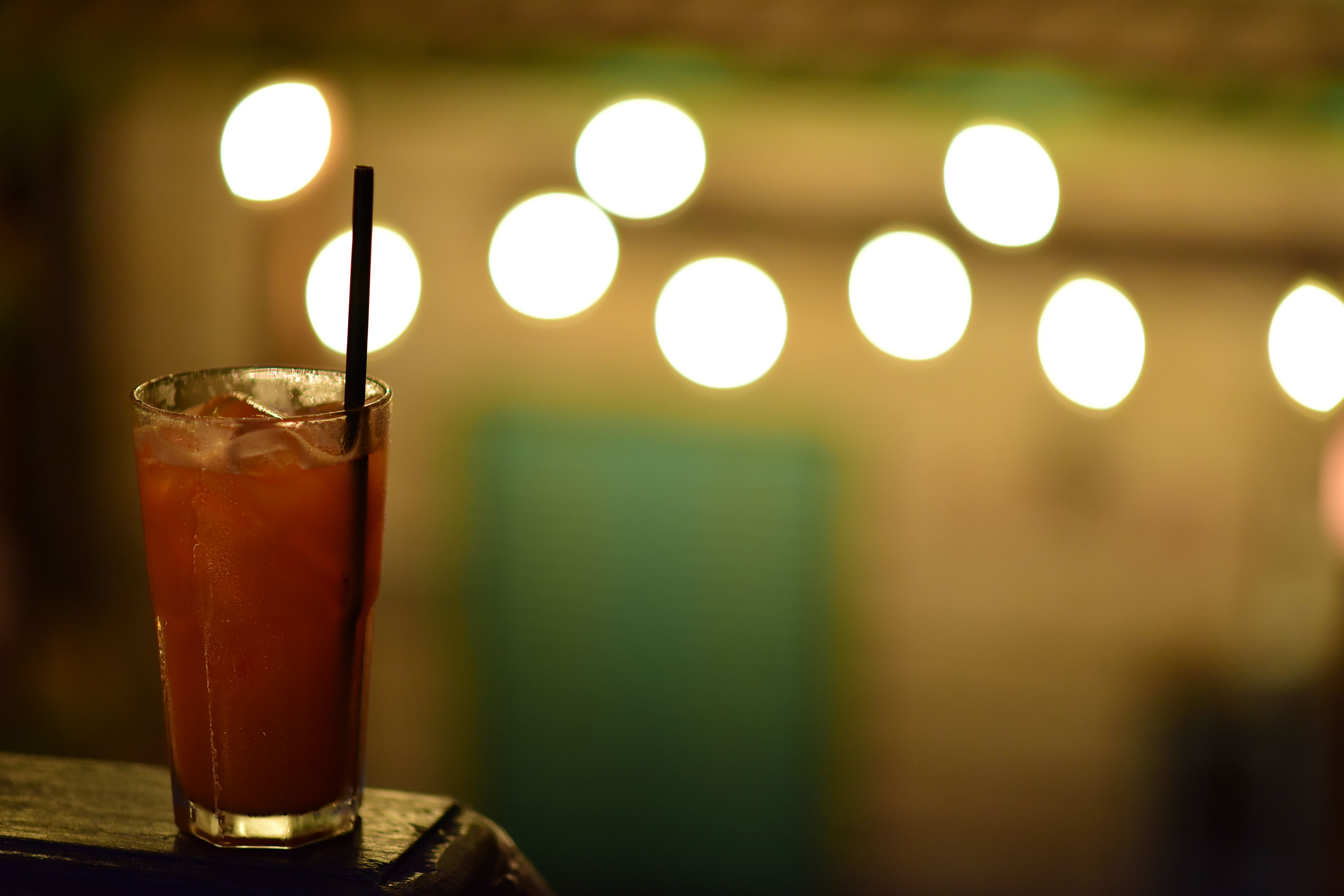 Glass of Iced Tea with Bokeh Lights in Background · Free Stock Photo