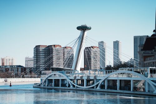 Free Stunning view of modern architecture and skyline in Tianjin, China with blue skies and river reflections. Stock Photo