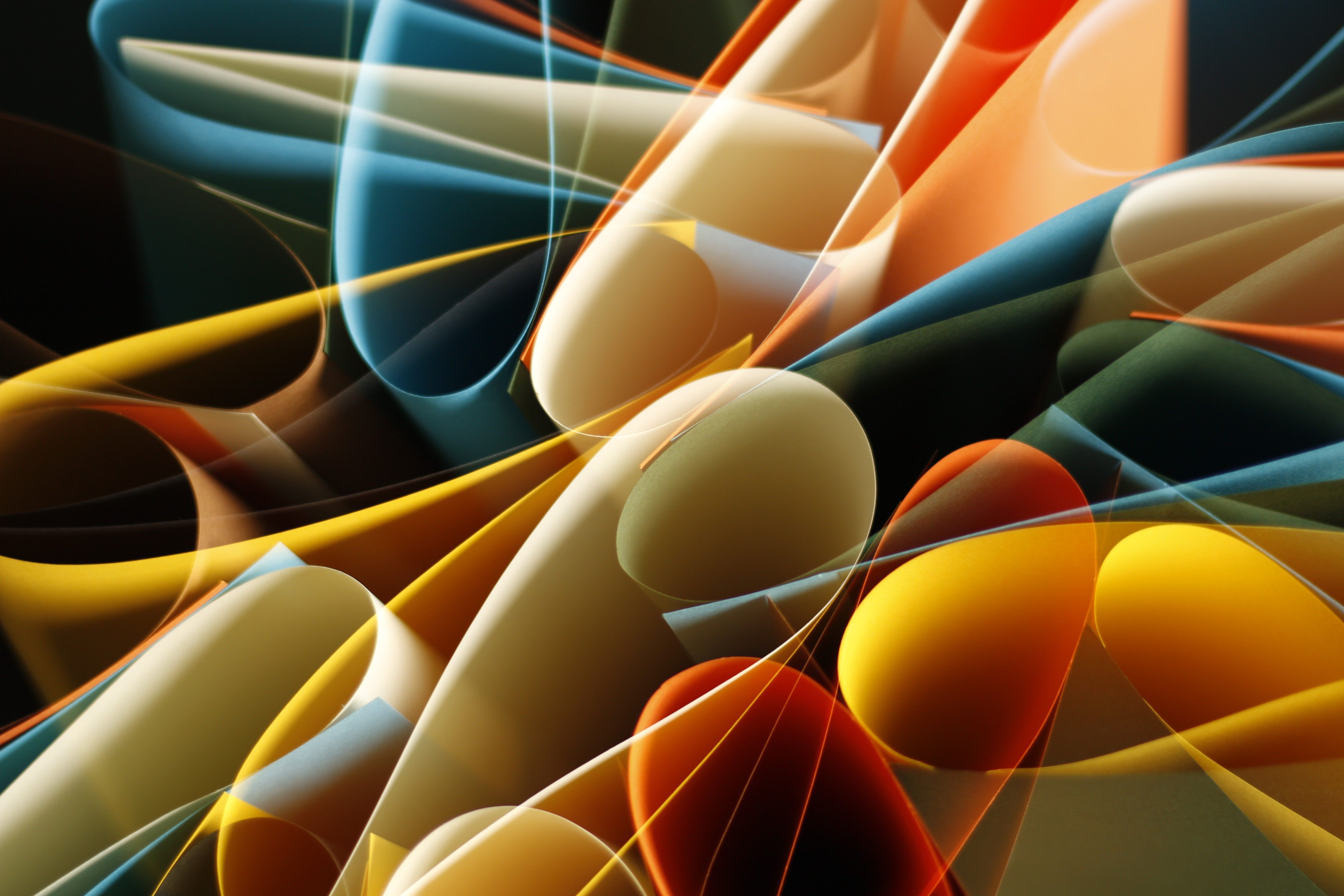 Colorful abstract light painting with swirling shapes and dynamic movement, capturing vibrant energy.