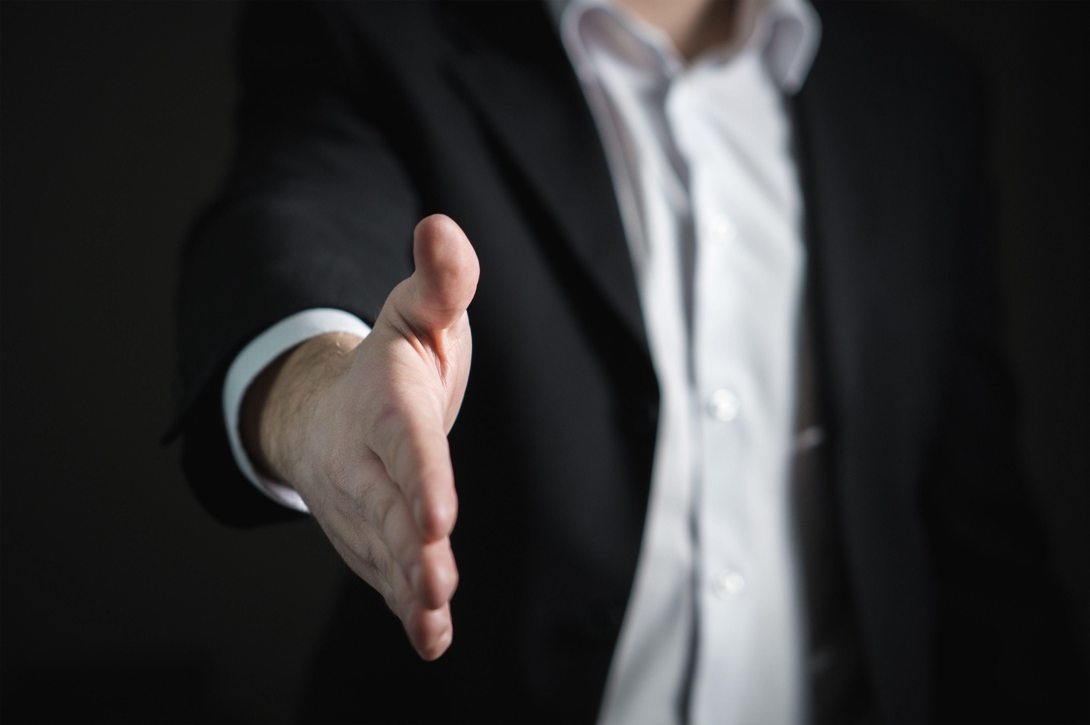 A handshake across the meeting table