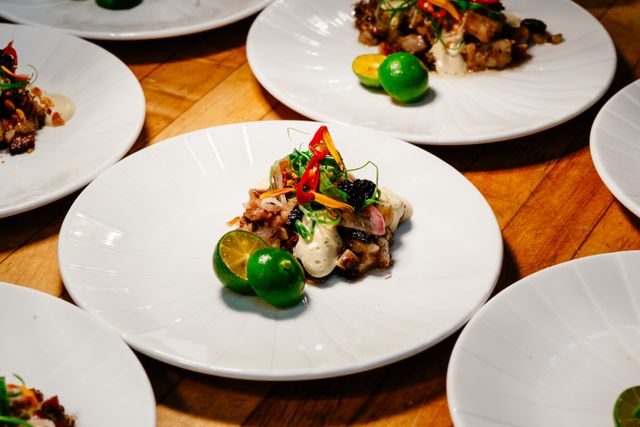 Exquisite gourmet Filipino dish served in fine dining setting, showcasing vibrant presentation.