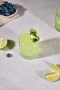 Refreshing Lime Juice with Cucumber and Blueberry Garnish