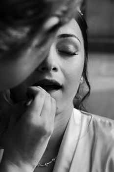 Close-up of a bride getting her makeup done in São Paulo, Brazil.