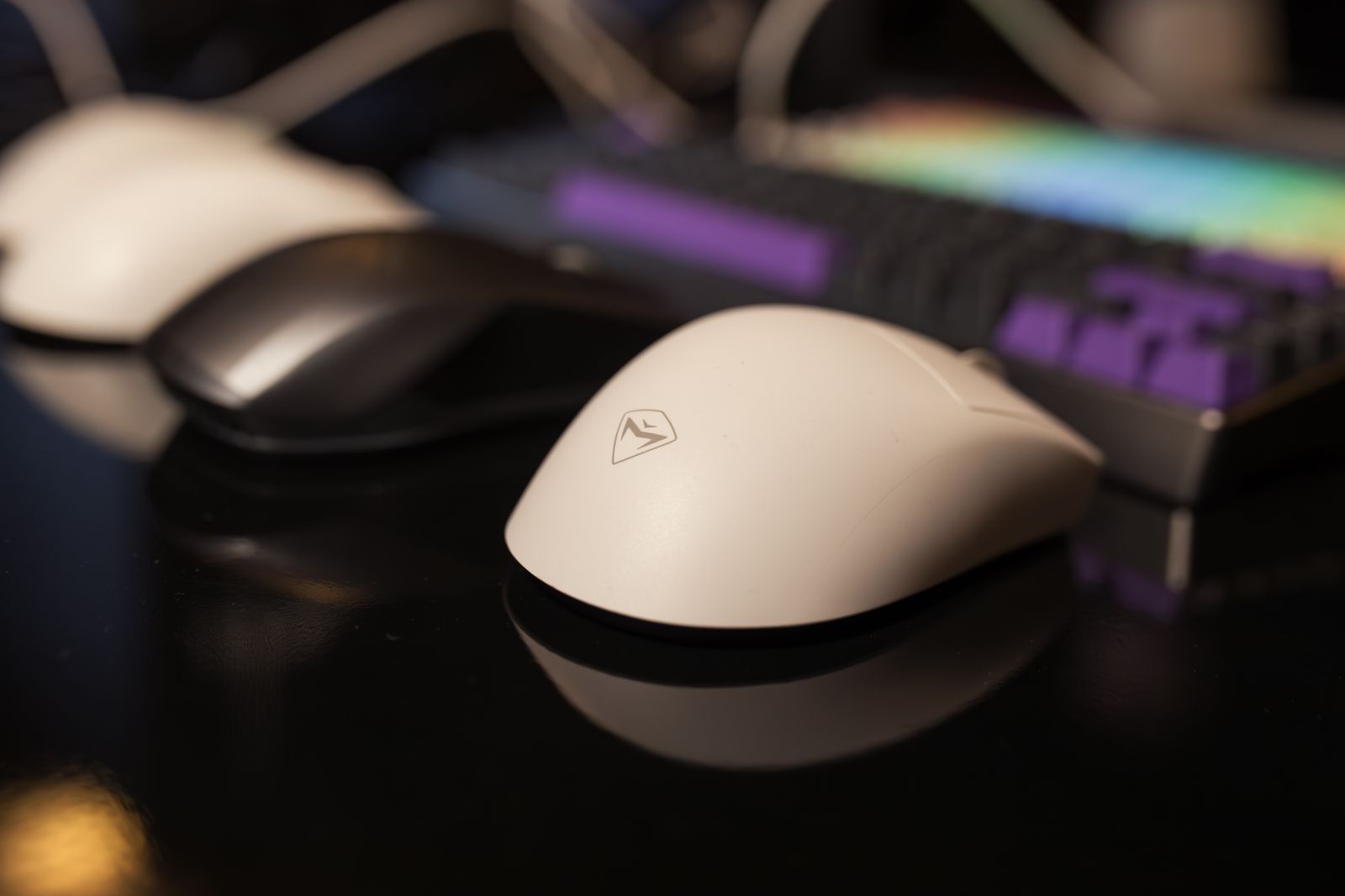 Close view of a gaming mouse and illuminated mechanical keyboard