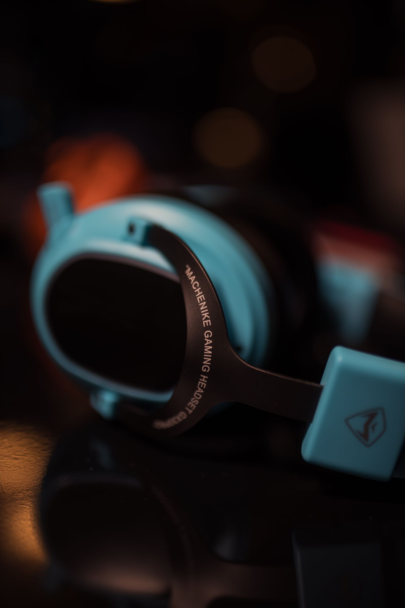 Close view of a modern gaming headset on a dark surface
