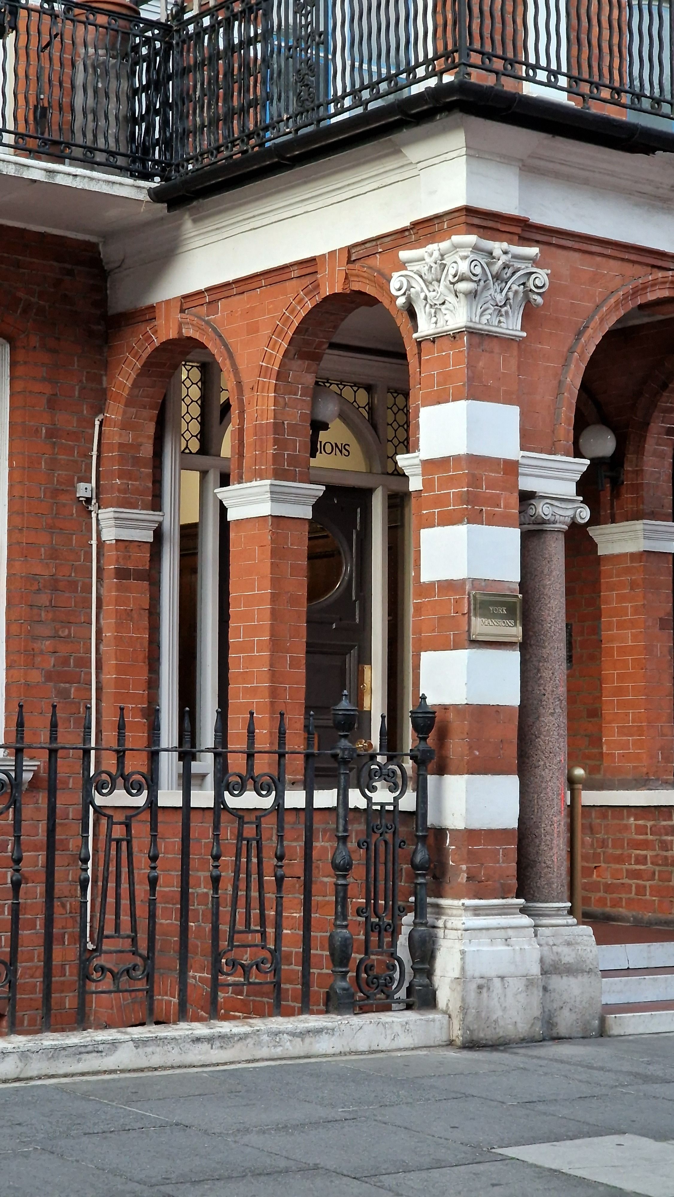 Elegant Red Brick Building with Arched Windows · Free Stock Photo
