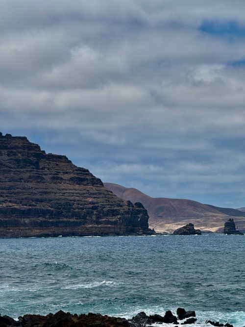 Free Explore the rugged coastal cliffs of Lanzarote, capturing the natural beauty of the Canary Islands. Stock Photo