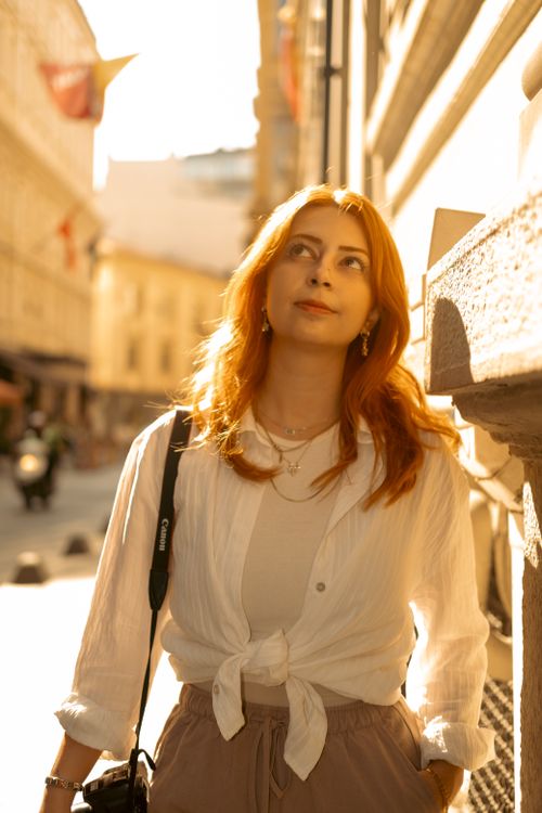 Free A woman walks through a sunlit street in Istanbul, exuding style and confidence. Stock Photo