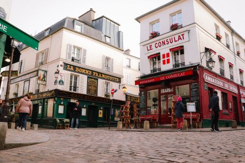 Free Charming street view of iconic Montmartre cafes in Paris, France. Stock Photo