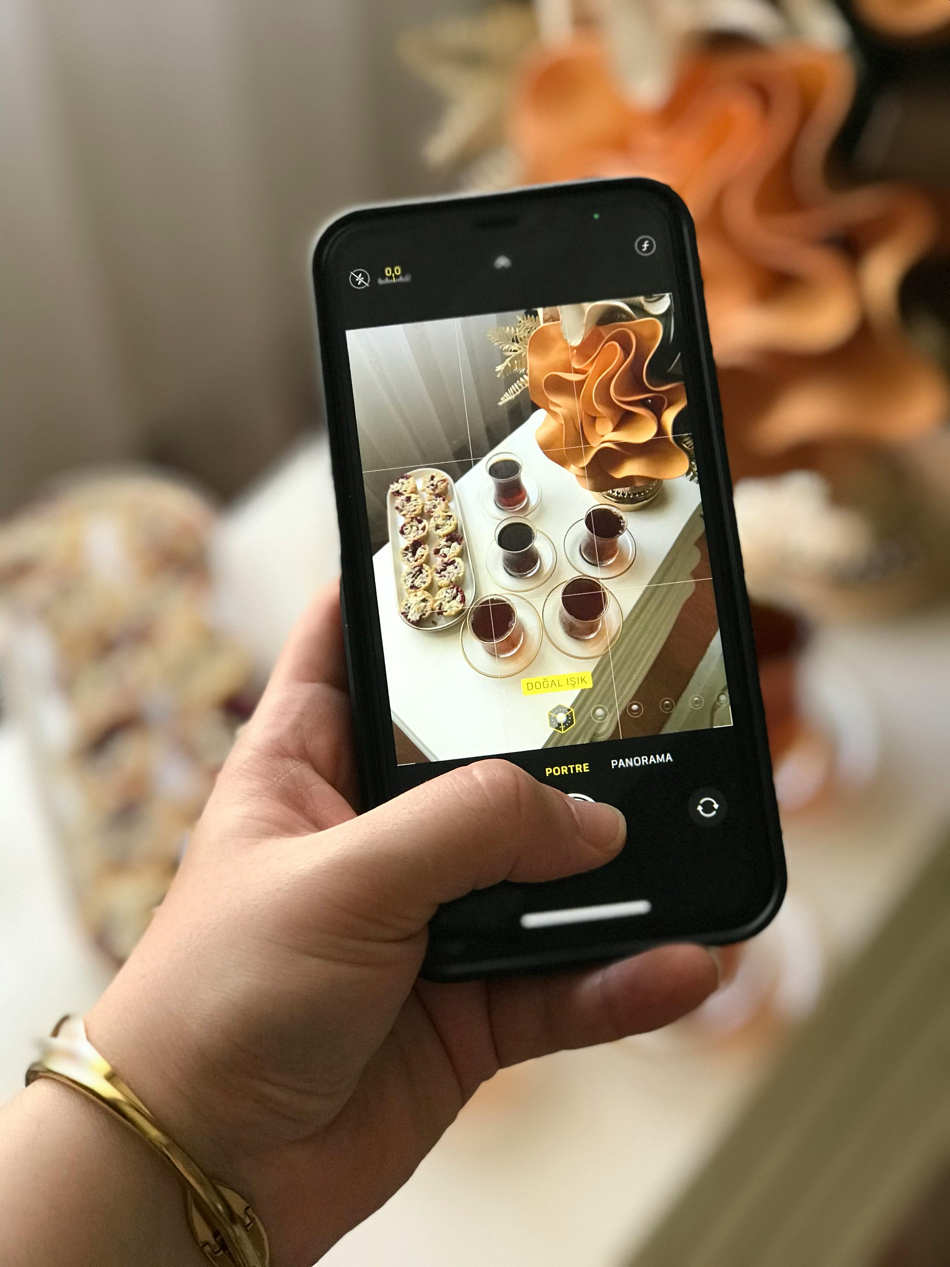 Free Artistic smartphone capture of a stylish coffee and snack arrangement. Stock Photo